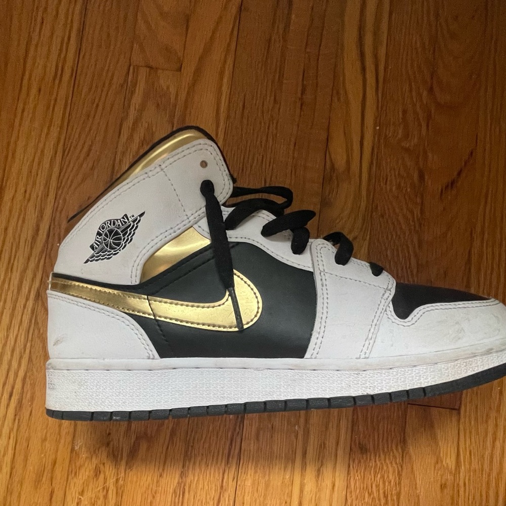 Black and gold Air Jordan’s